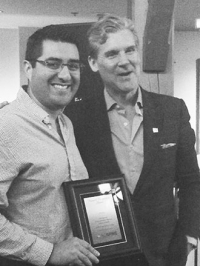 Dr. Rodrigo Navarro-Ramirez with award